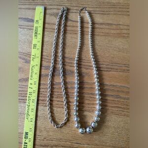 Two vintage gold colored necklaces